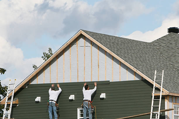 Professional Siding Replacement technician working in Uhrichsville, OH